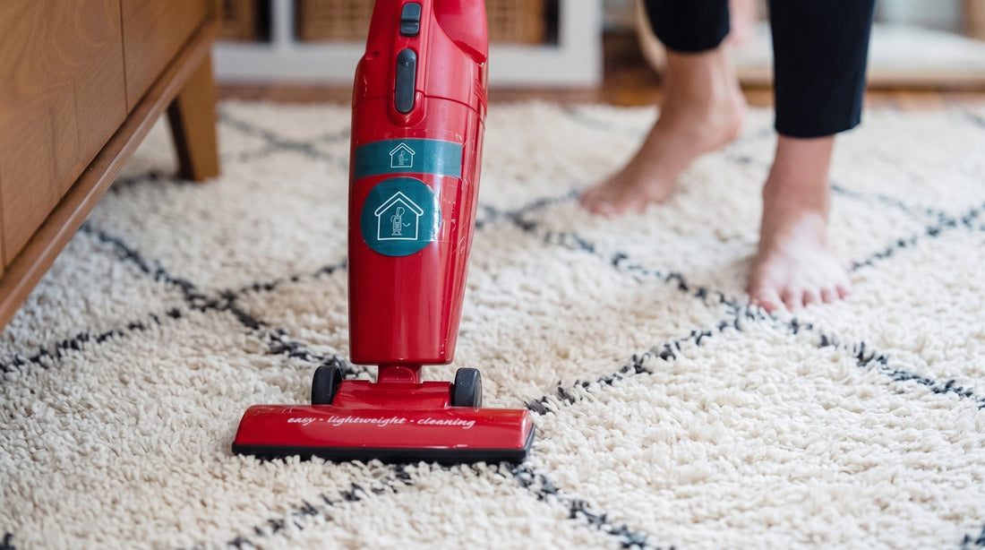 Vacuuming a Moroccan wool rug on a hardwood floor